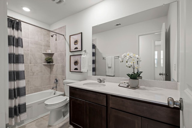 full bathroom with vanity, toilet, and shower / bath combo