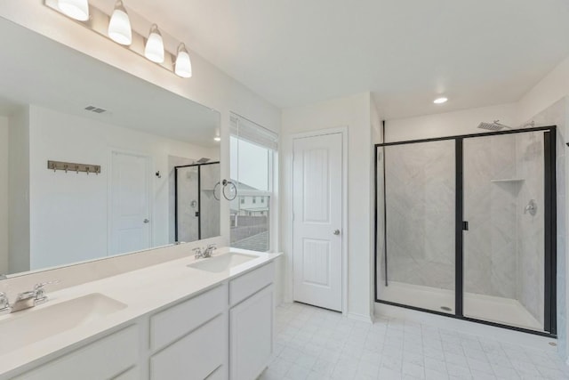 bathroom with vanity and an enclosed shower