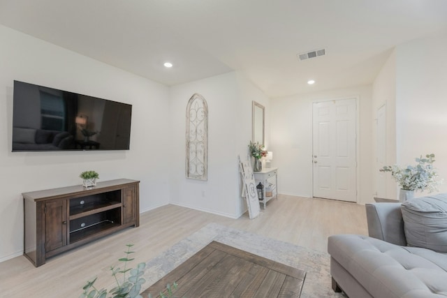 living room with light hardwood / wood-style flooring