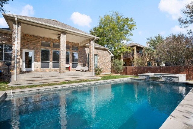 7017 Viridian Ln, Austin, TX 78739 - view of swimming pool with a wooden deck, ceiling fan, and a pool with connected hot tub