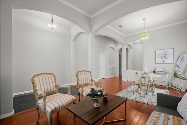 living room featuring ornamental molding and hardwood / wood-style floors