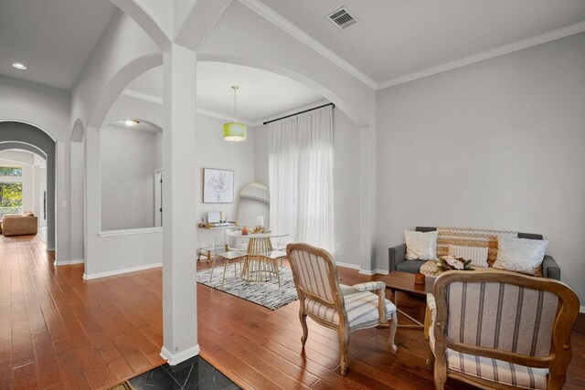 7017 Viridian Ln, Austin, TX 78739 - sitting room with arched walkways, baseboards, crown molding, wood finished floors, and recessed lighting
