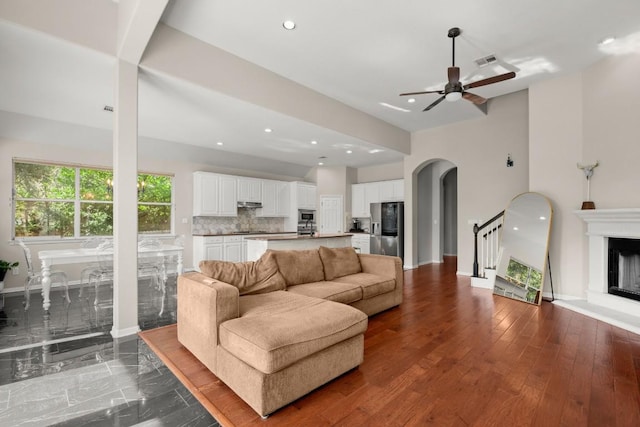 living room with ceiling fan and hardwood / wood-style floors