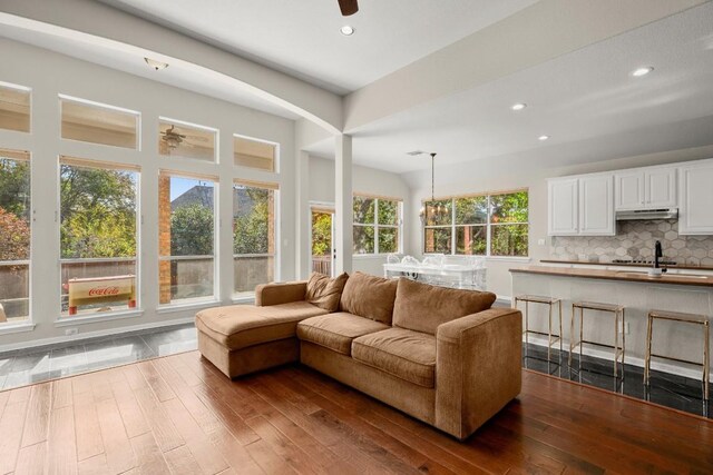 7017 Viridian Ln, Austin, TX 78739 - living room featuring dark wood-style flooring and recessed lighting