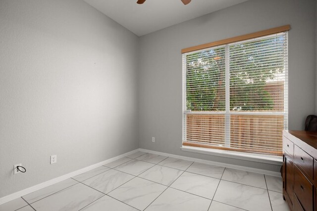 7017 Viridian Ln, Austin, TX 78739 - empty room featuring baseboards, ceiling fan, and light marble finish floors