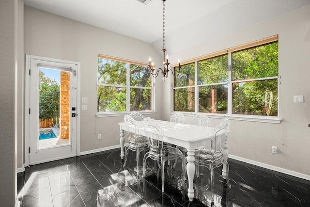 dining space featuring an inviting chandelier