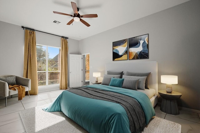 bedroom with ceiling fan and access to exterior