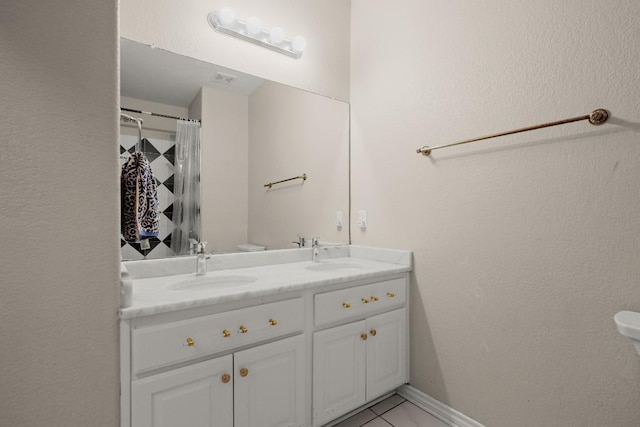 bathroom with vanity, toilet, and walk in shower