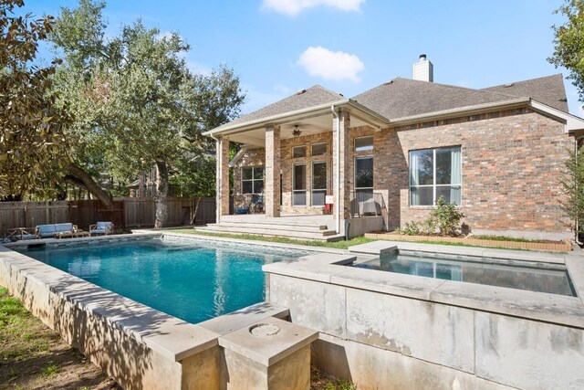 7017 Viridian Ln, Austin, TX 78739 - view of swimming pool featuring an in-ground hot tub, a ceiling fan, a fenced backyard, and a patio