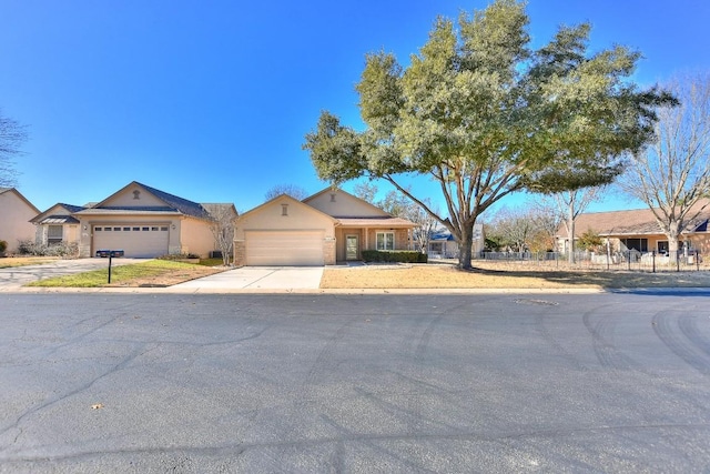 ranch-style house with a garage and concrete driveway