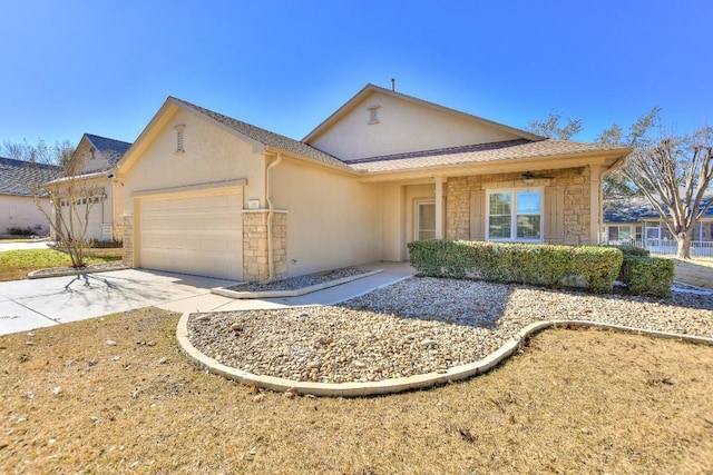 ranch-style home featuring a garage, stone siding, concrete driveway, and stucco siding