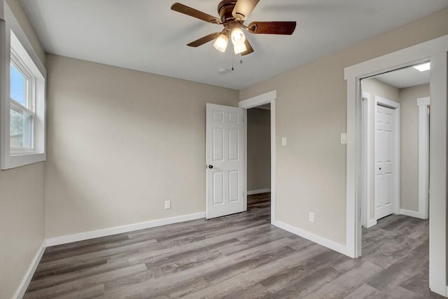 unfurnished bedroom with light hardwood / wood-style floors and ceiling fan