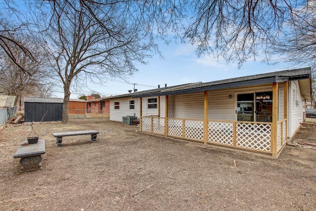 back of property with cooling unit and a storage unit