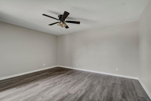 spare room featuring hardwood / wood-style flooring and ceiling fan