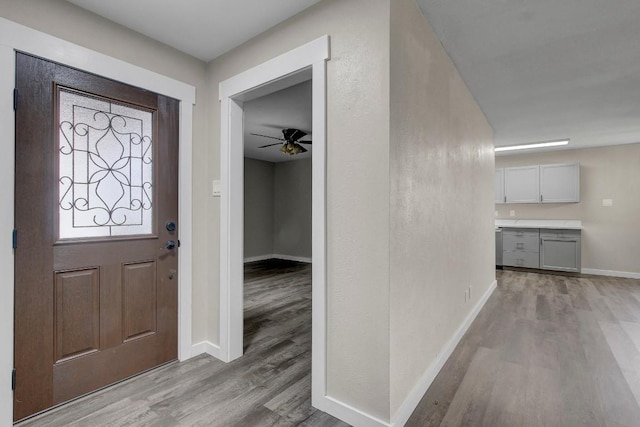 entryway featuring ceiling fan and light hardwood / wood-style floors