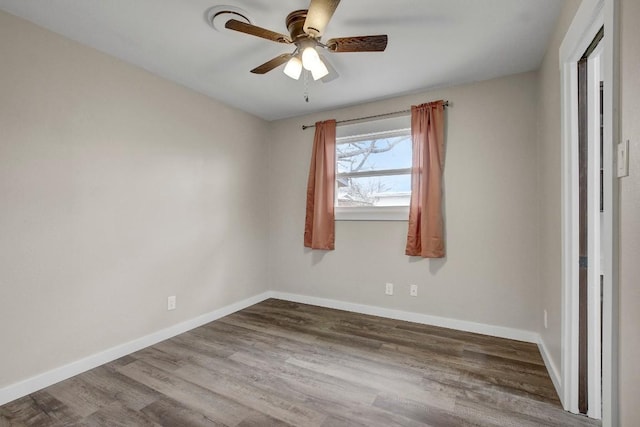 unfurnished room featuring hardwood / wood-style flooring and ceiling fan