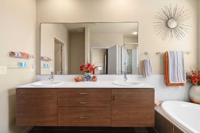 bathroom with plus walk in shower, vanity, and tile patterned floors