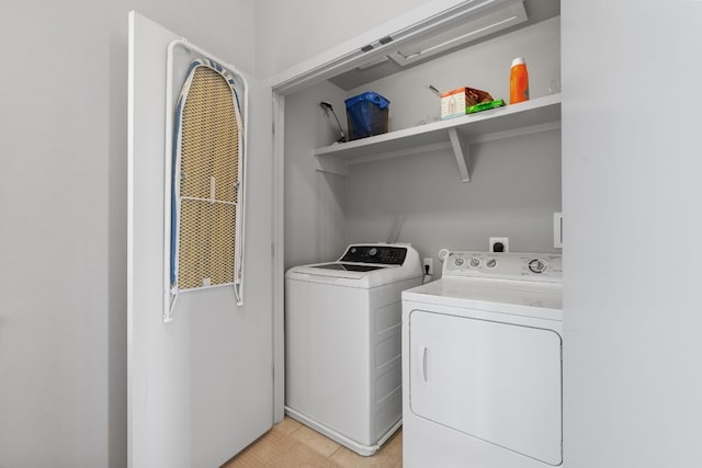 laundry area with independent washer and dryer