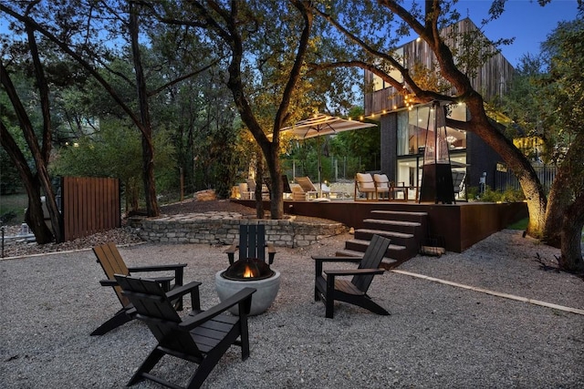 view of yard with a patio area and an outdoor fire pit