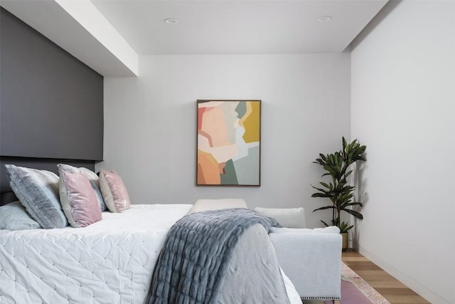 bedroom featuring wood-type flooring