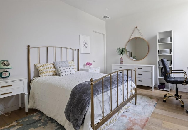 bedroom featuring light hardwood / wood-style flooring