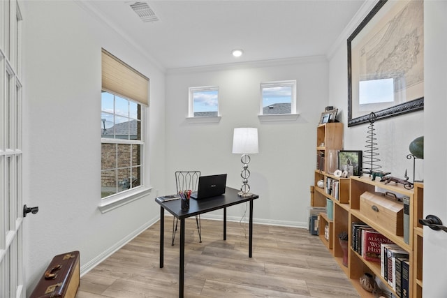 office space featuring crown molding and light wood-type flooring