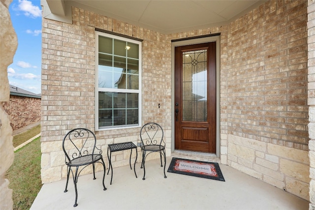 722 Kitty Hawk Rd, Georgetown, TX 78633 - view of exterior entry with brick siding and a porch