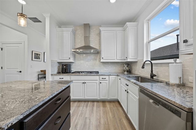 722 Kitty Hawk Rd, Georgetown, TX 78633 - kitchen featuring wall chimney exhaust hood, stainless steel dishwasher, light wood-type flooring, white cabinets, and ornamental molding