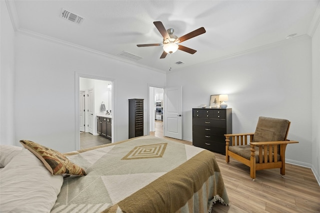 bedroom with hardwood / wood-style flooring, ceiling fan, ornamental molding, and connected bathroom