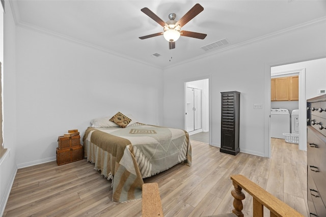 bedroom featuring ornamental molding, light hardwood / wood-style flooring, washing machine and dryer, and ceiling fan