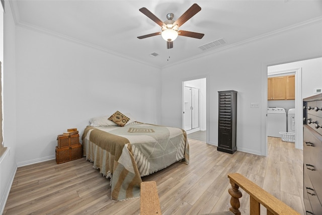 722 Kitty Hawk Rd, Georgetown, TX 78633 - bedroom featuring independent washer and dryer, crown molding, light wood-type flooring, and a ceiling fan