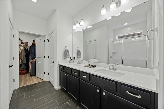 bathroom with vanity and an enclosed shower