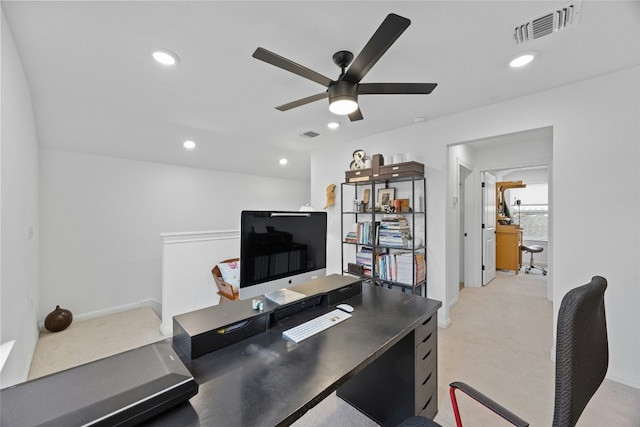 carpeted home office with ceiling fan