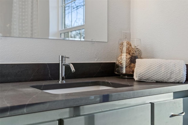 room details with a textured wall and a sink