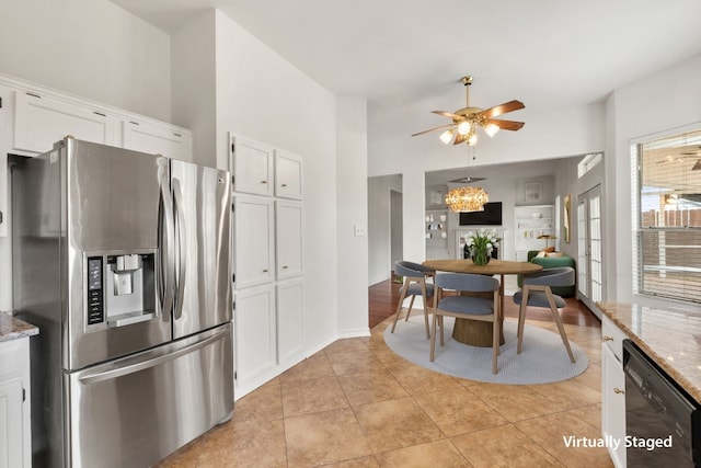 kitchen featuring stainless steel refrigerator with ice dispenser, black dishwasher, white cabinets, and light stone counters