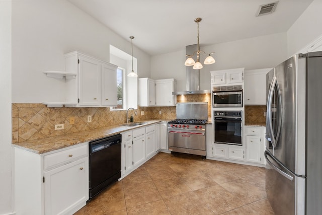 kitchen featuring decorative light fixtures, white cabinetry, sink, light stone counters, and black appliances