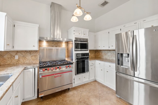 kitchen with white cabinetry, wall chimney range hood, hanging light fixtures, and appliances with stainless steel finishes