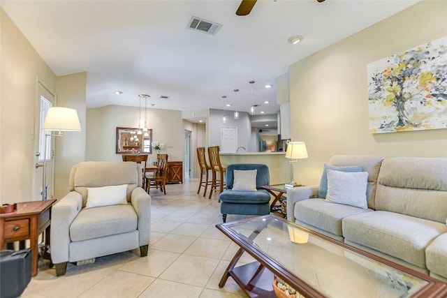 living room with light tile patterned flooring and ceiling fan