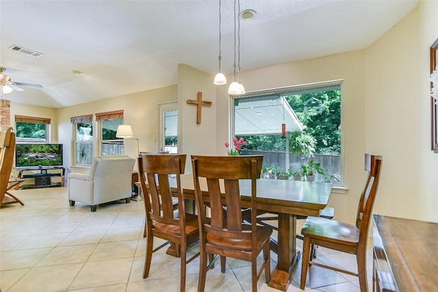 dining area with ceiling fan and light tile patterned floors