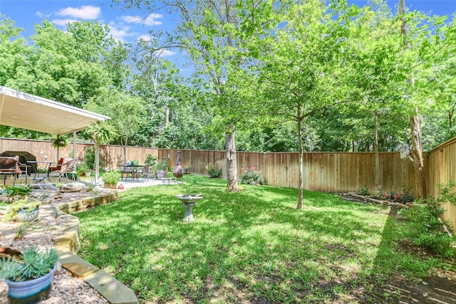 8013 Doe Meadow Dr, Austin, TX 78749 - fenced backyard with a patio