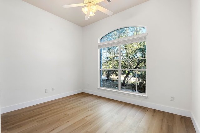 unfurnished room with ceiling fan and light hardwood / wood-style flooring