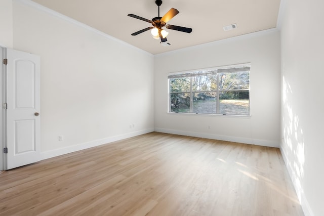 spare room featuring crown molding, ceiling fan, and light wood-type flooring