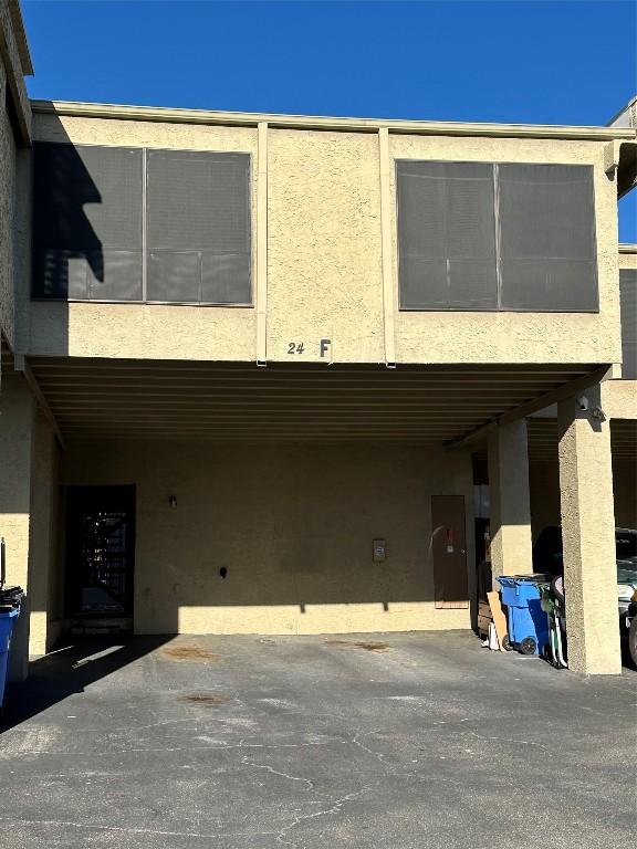 exterior space featuring a carport