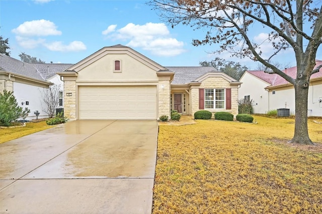 single story home with cooling unit, a garage, and a front yard