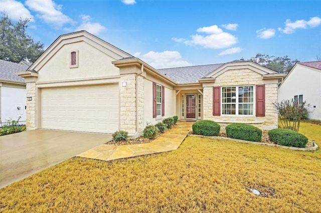 single story home with a garage and a front lawn