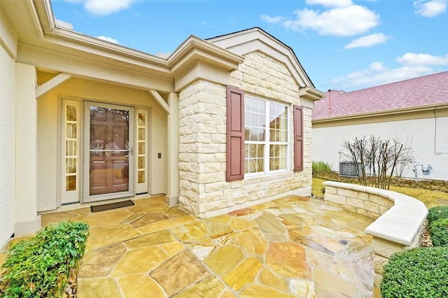 entrance to property with a patio area