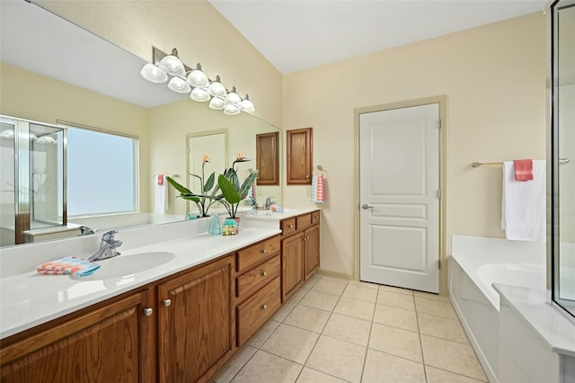 bathroom with vanity, a bath, and tile patterned flooring