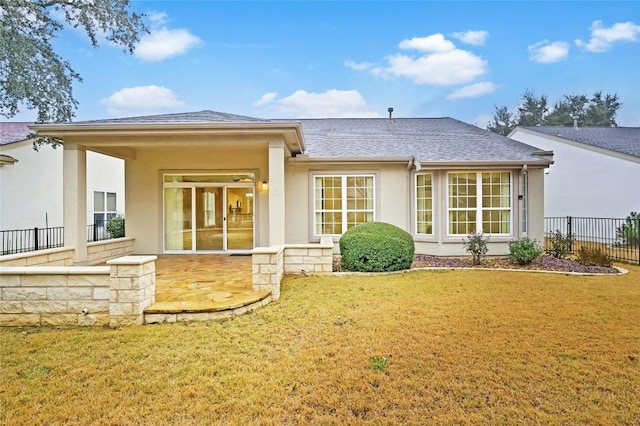 rear view of house with a lawn