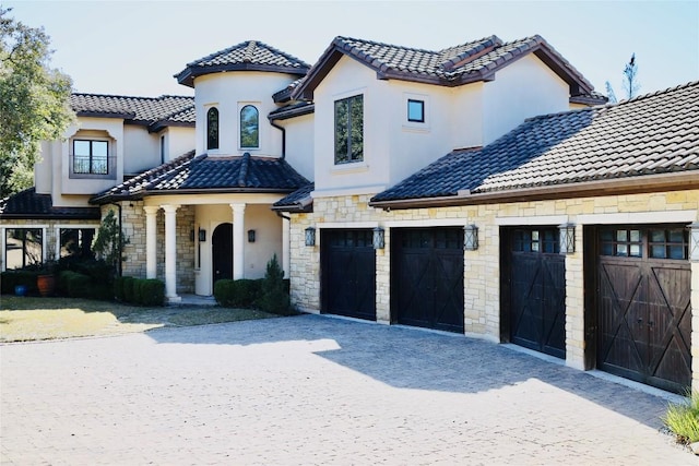 mediterranean / spanish house featuring a garage