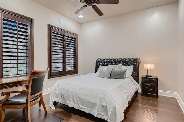 bedroom featuring ceiling fan and dark hardwood / wood-style floors